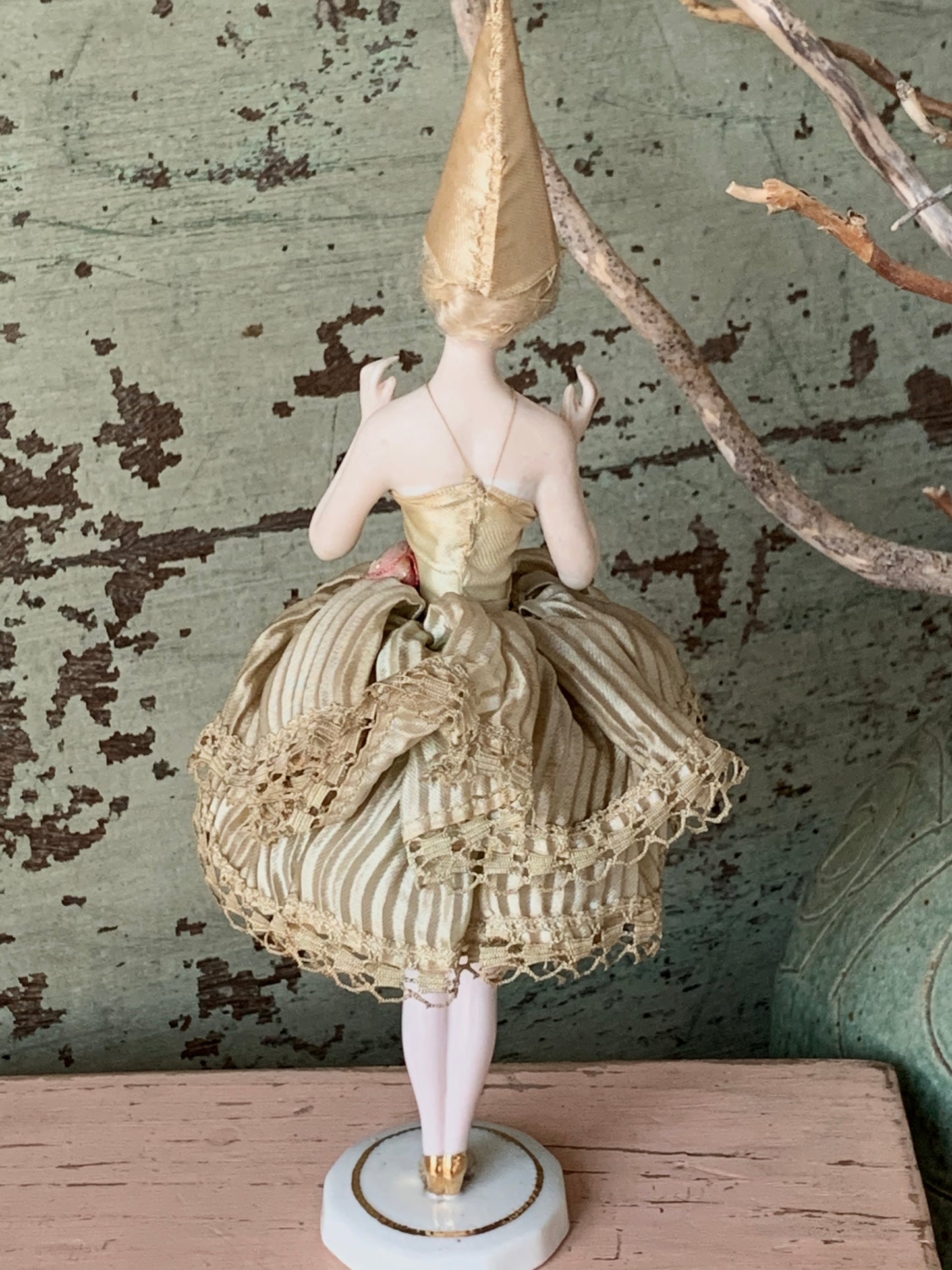 Antique porcelain masked girl figurine