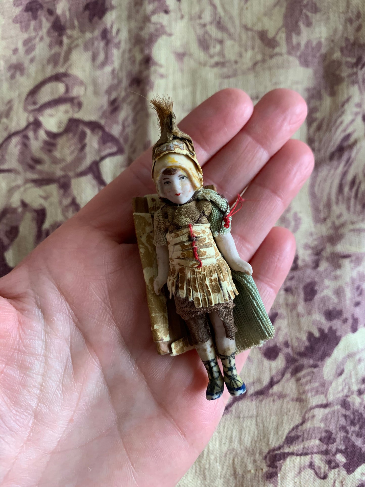 Antique miniature bisque warrior doll