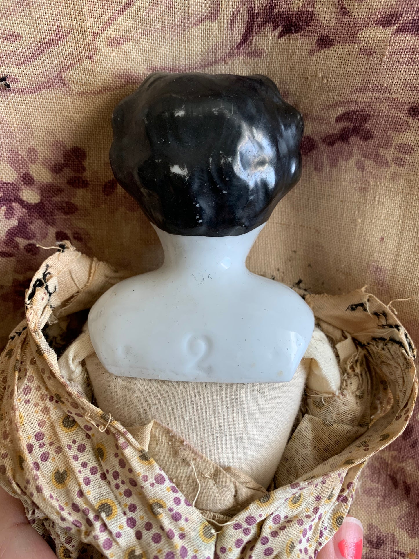 Antique china doll with blue boots