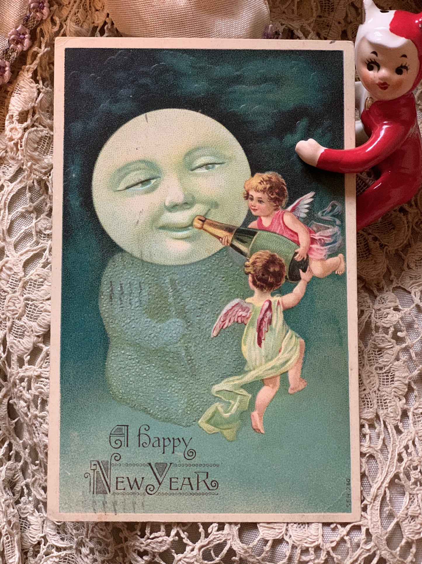 Antique Happy New Year moon baby postcard