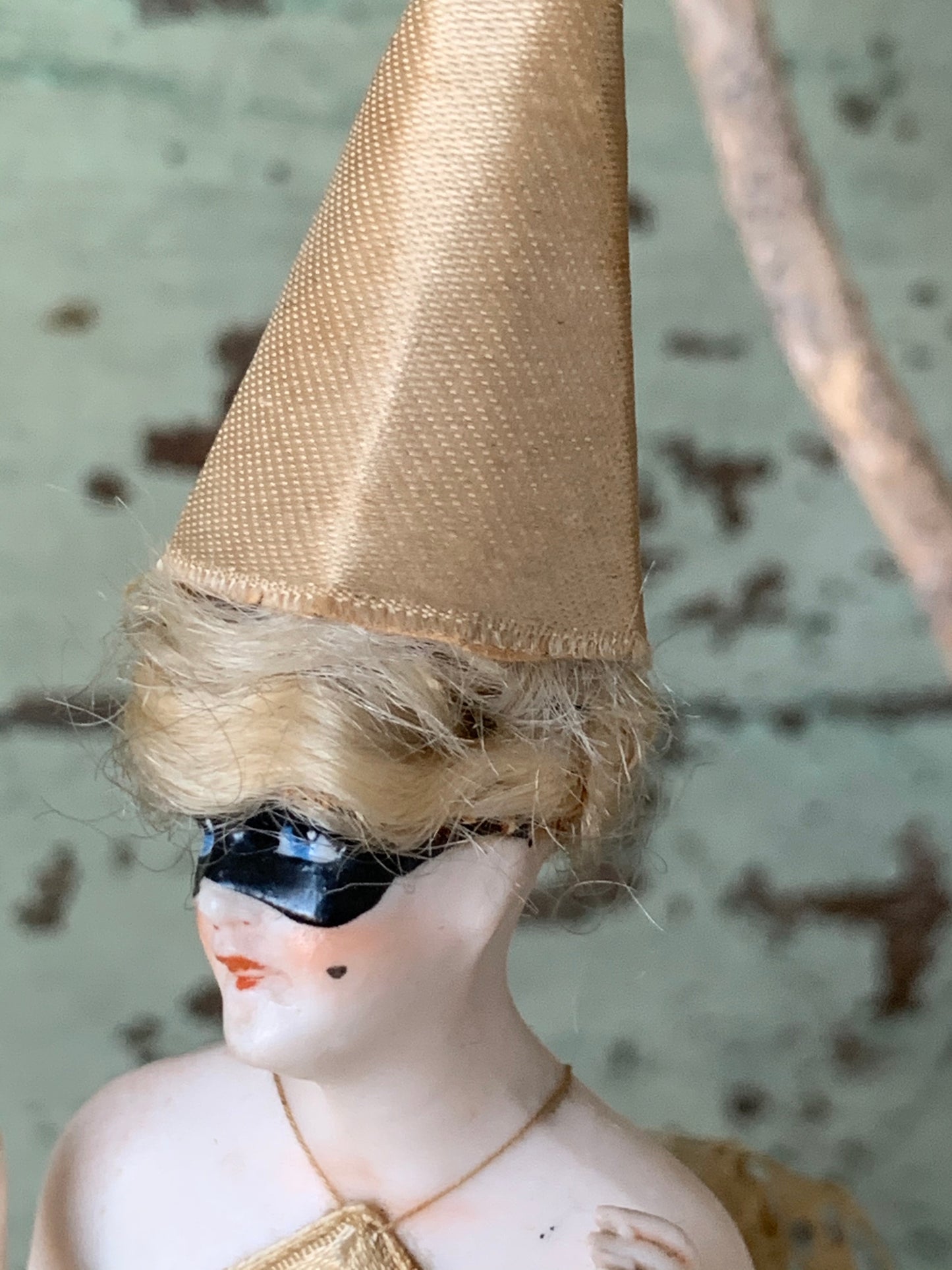 Antique porcelain masked girl figurine