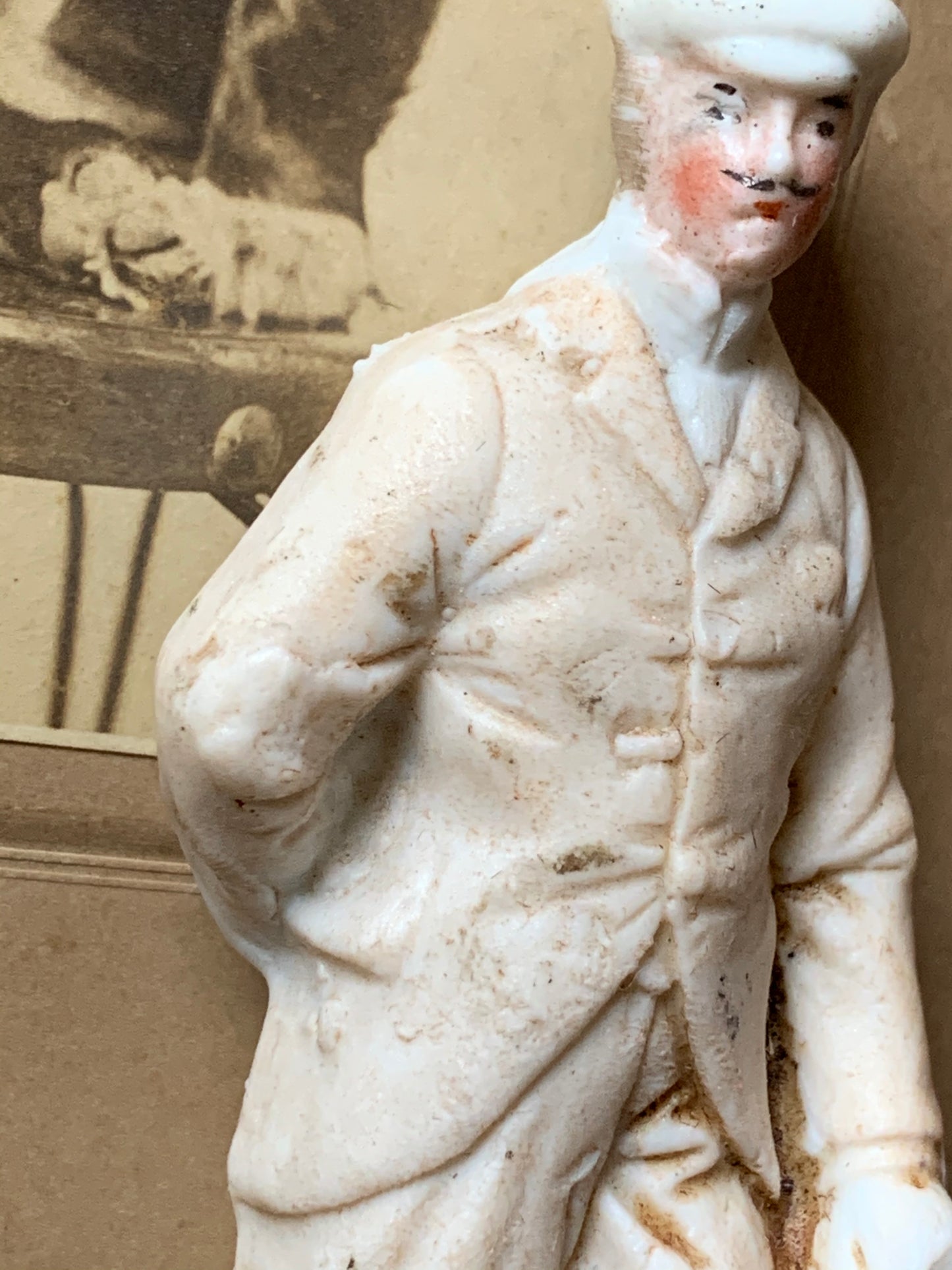 Antique miniature golfer figurine