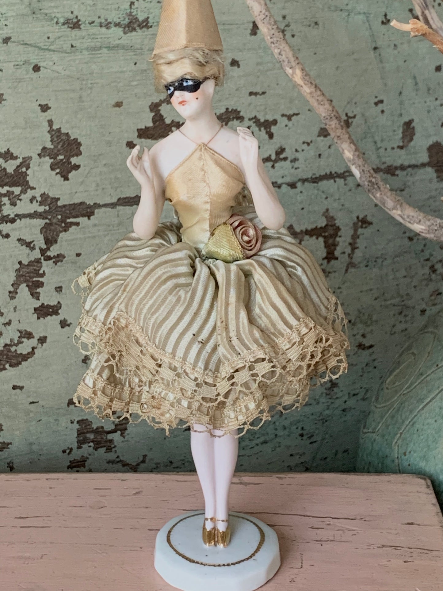 Antique porcelain masked girl figurine