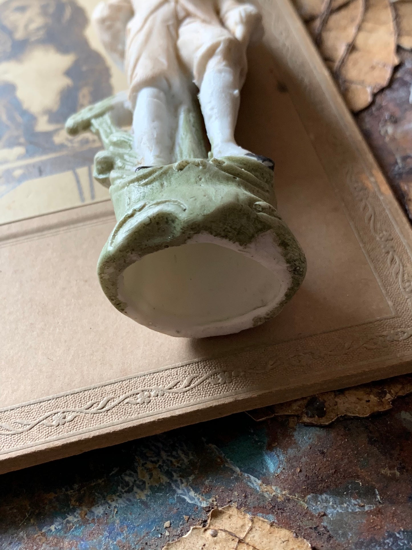 Antique miniature golfer figurine