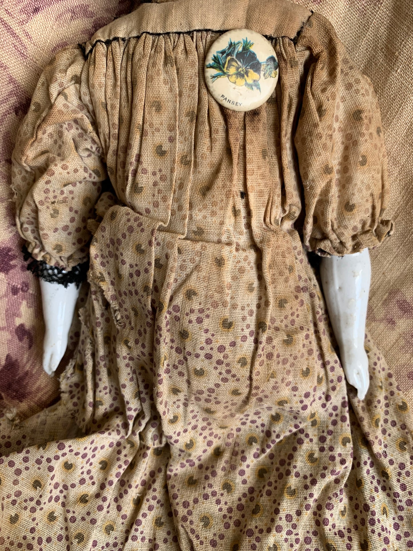 Antique china doll with blue boots