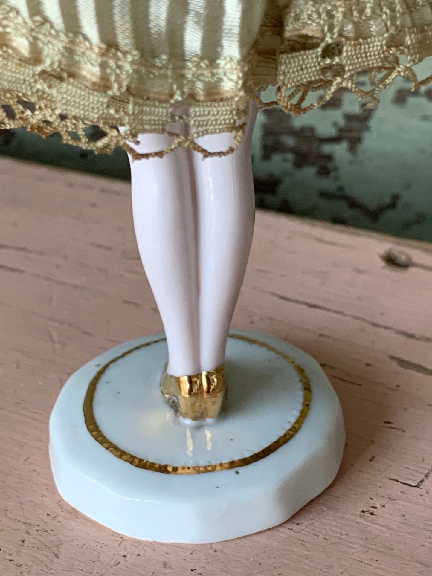 Antique porcelain masked girl figurine