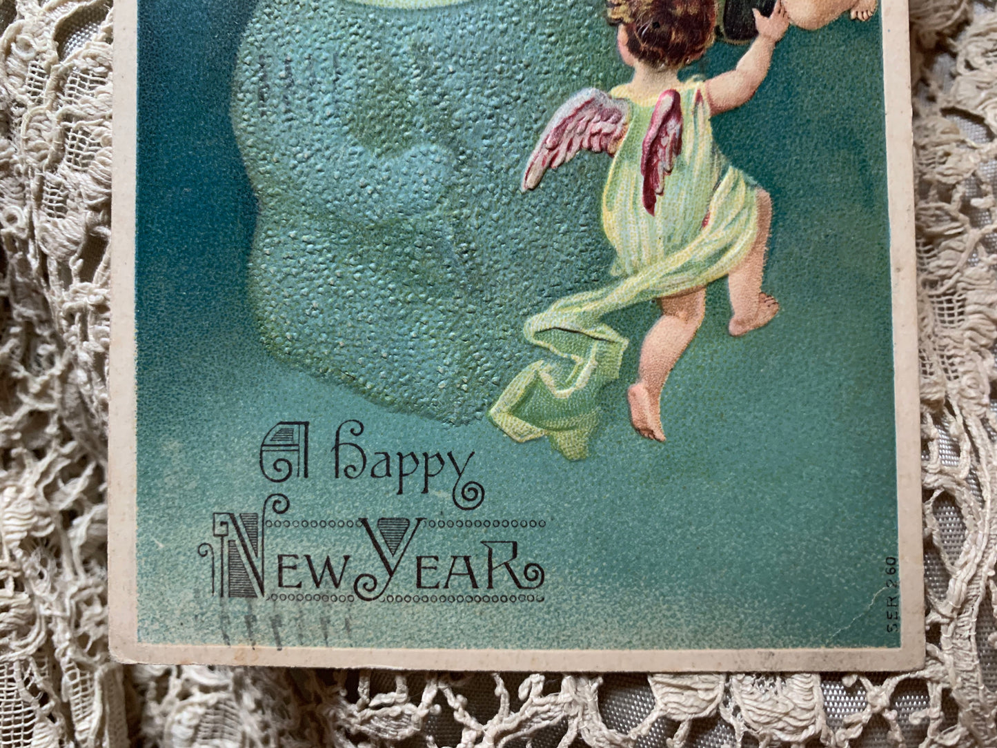 Antique Happy New Year moon baby postcard