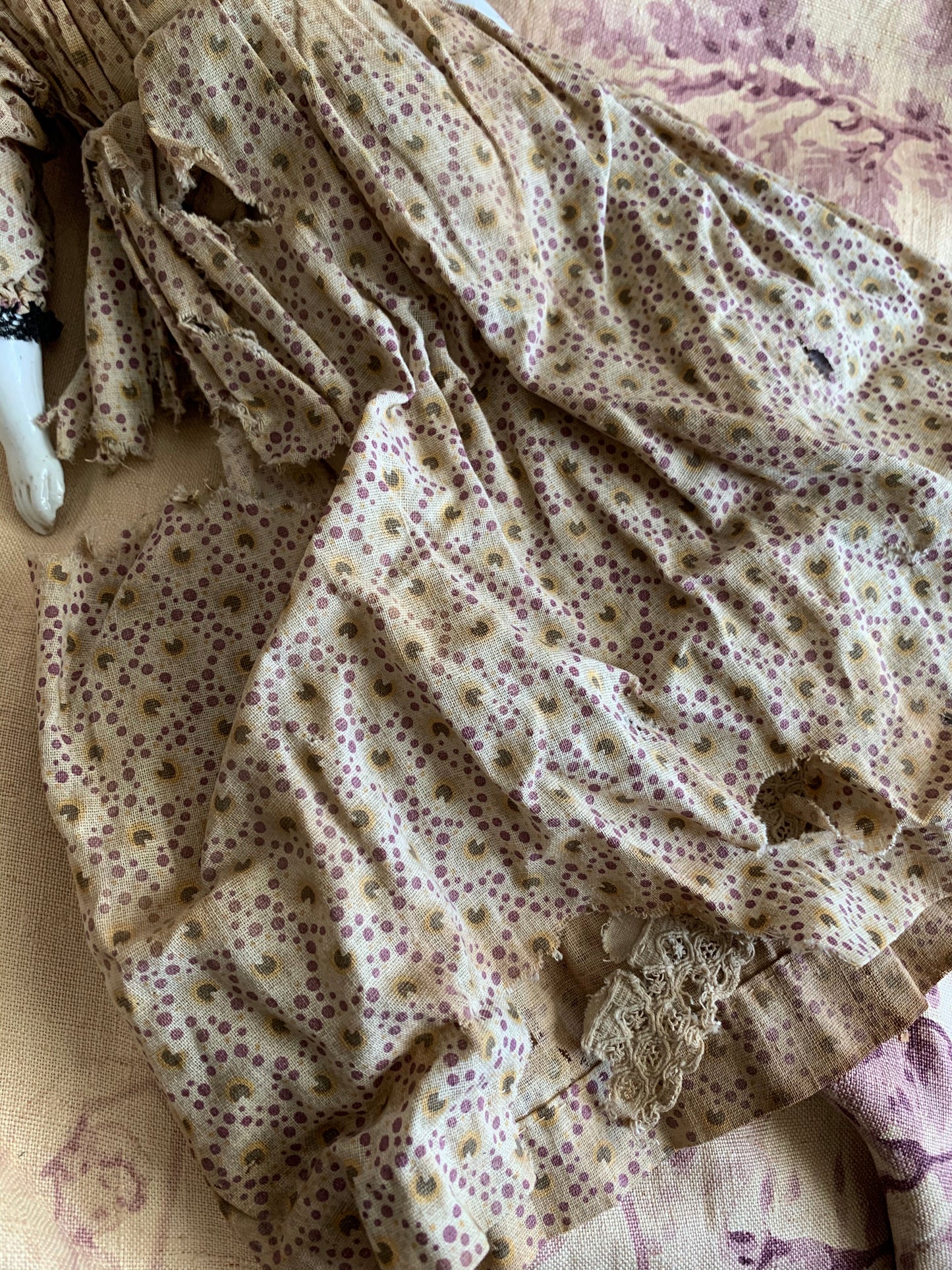 Antique china doll with blue boots