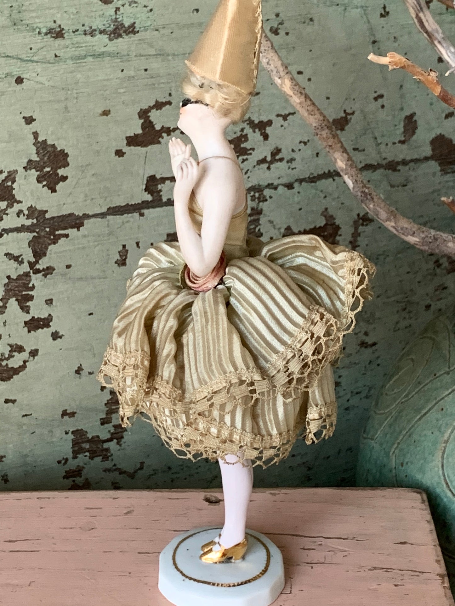 Antique porcelain masked girl figurine