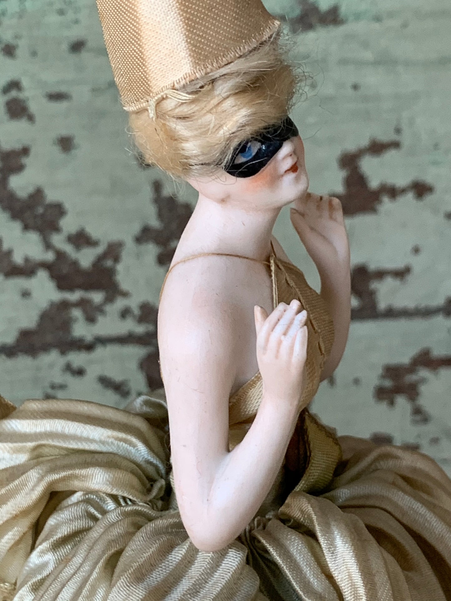 Antique porcelain masked girl figurine