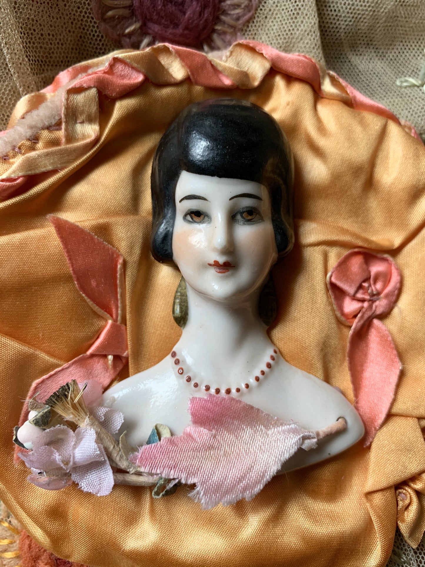 Vintage porcelain half doll flat back bust on silk