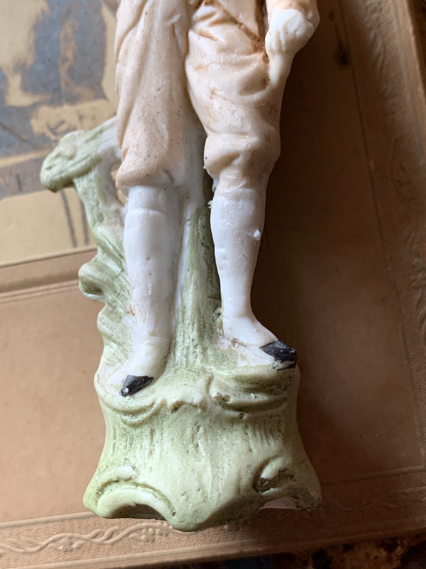 Antique miniature golfer figurine