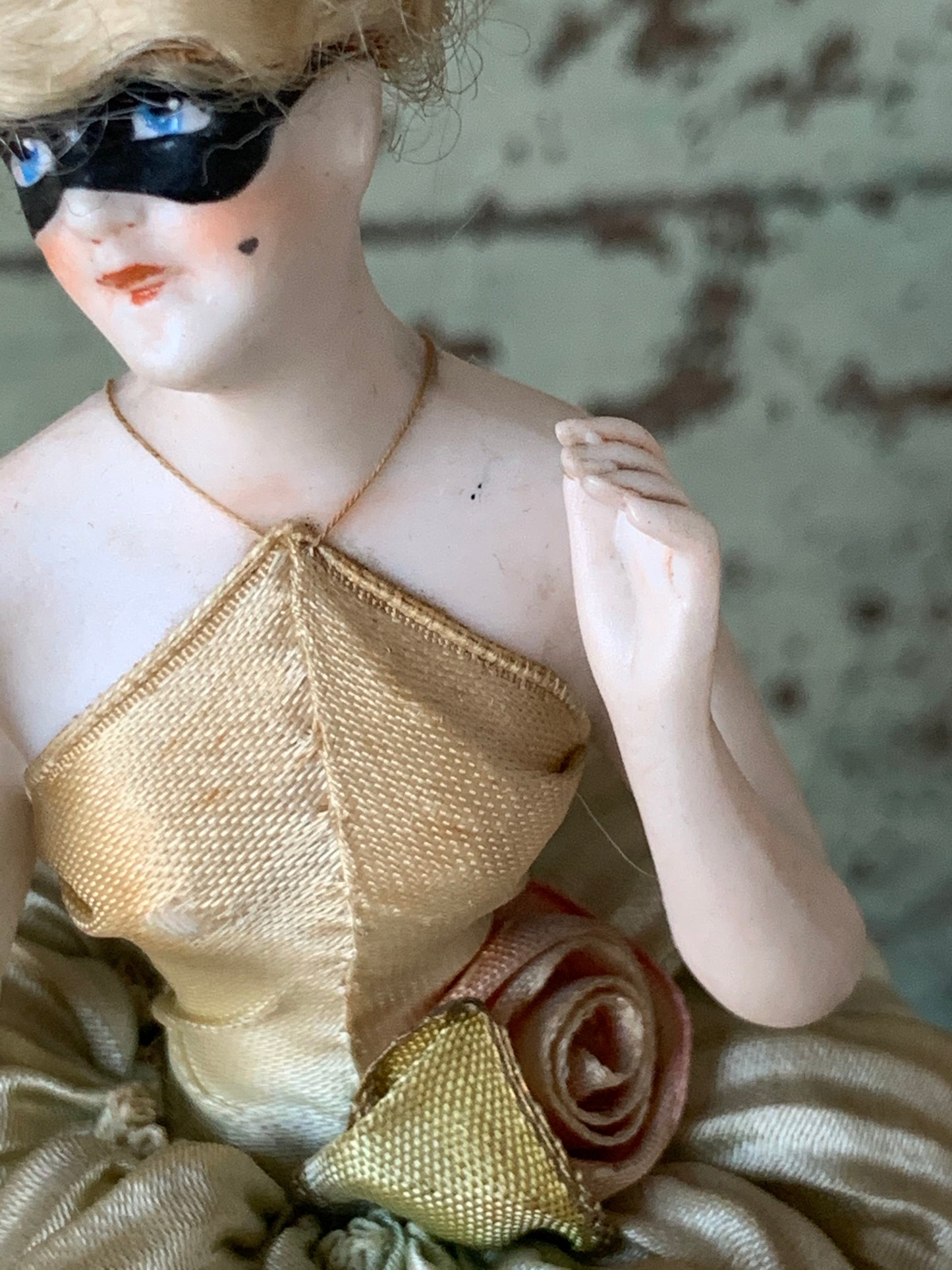 Antique porcelain masked girl figurine