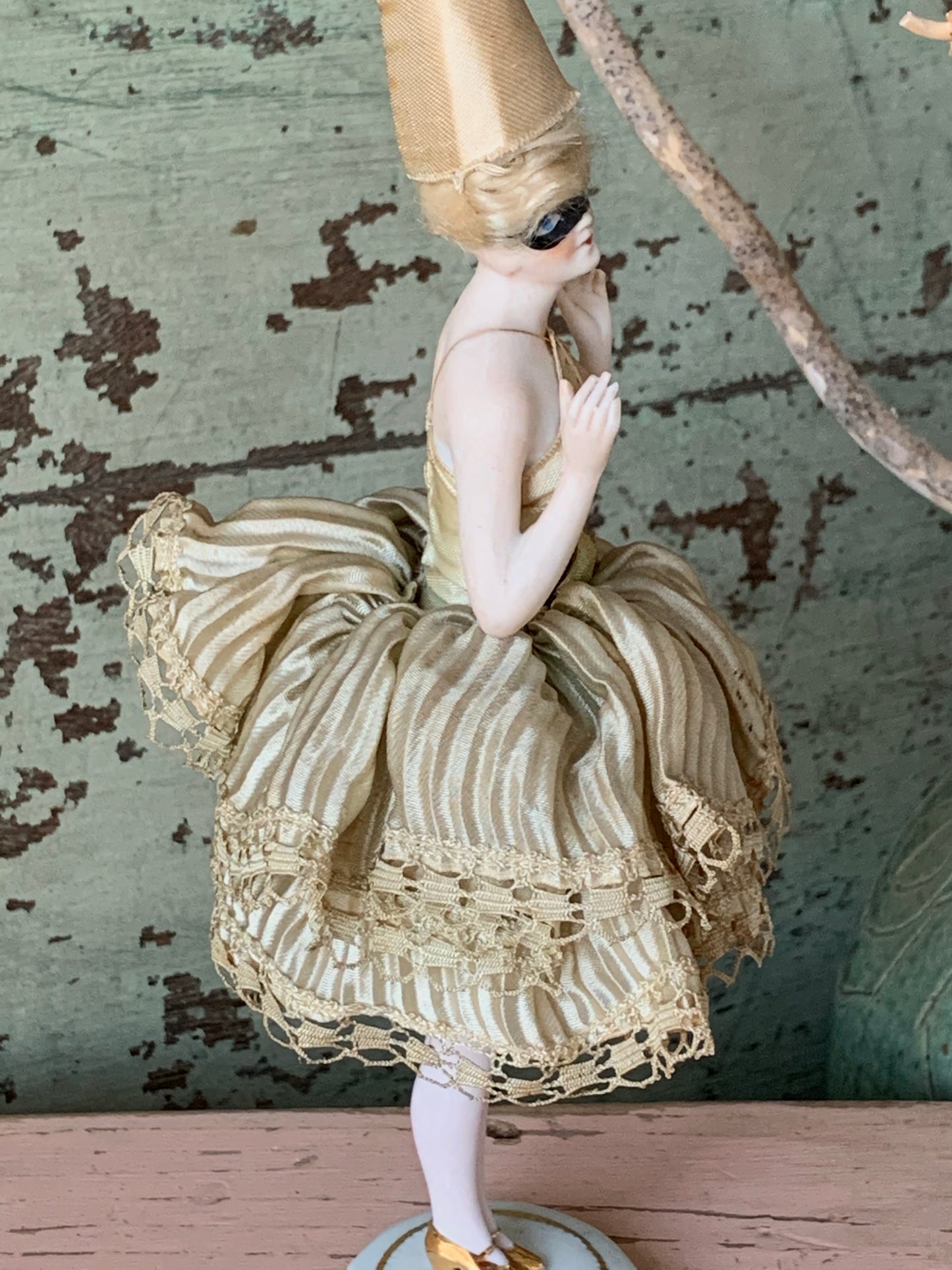 Antique porcelain masked girl figurine
