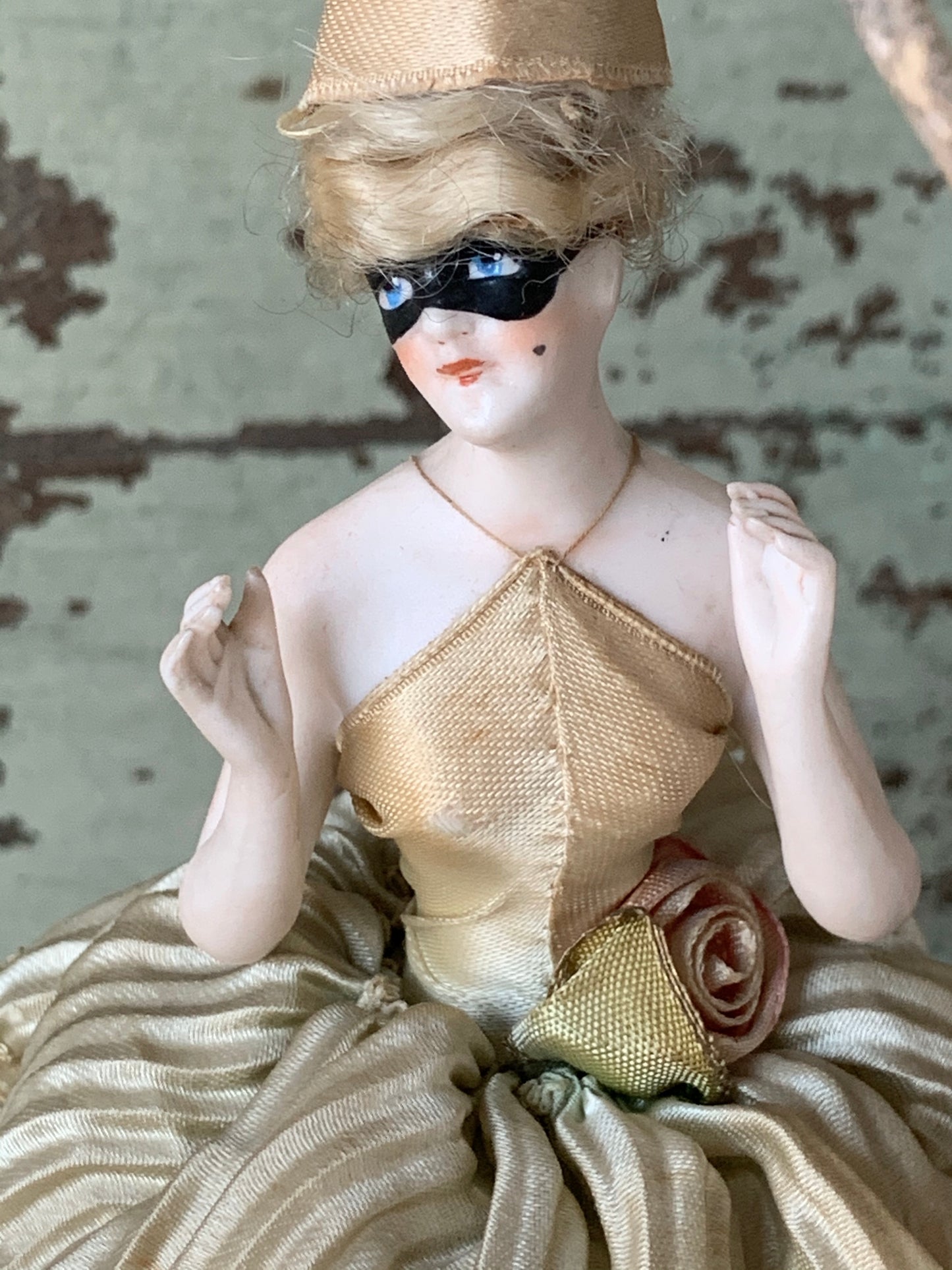 Antique porcelain masked girl figurine