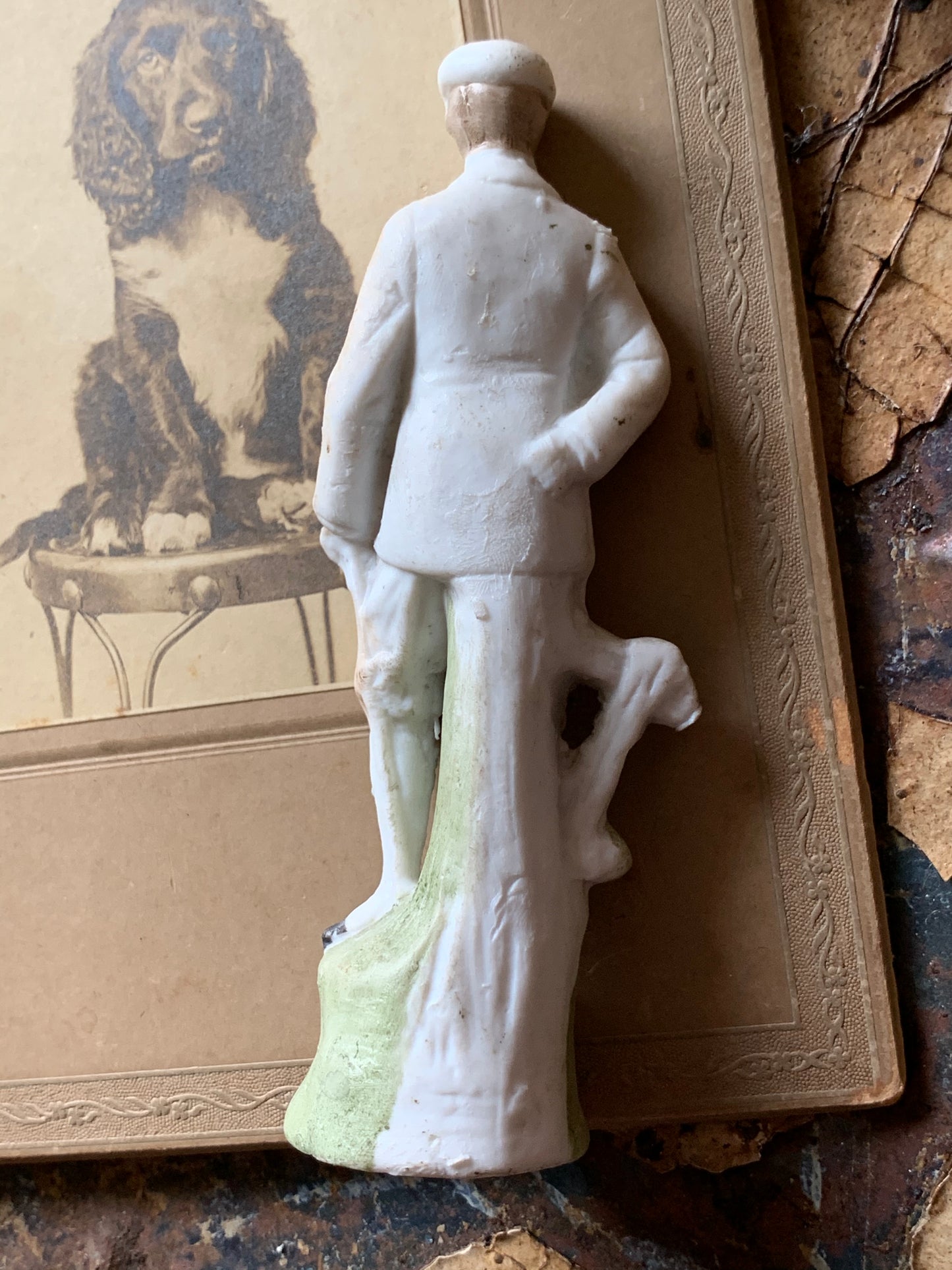 Antique miniature golfer figurine