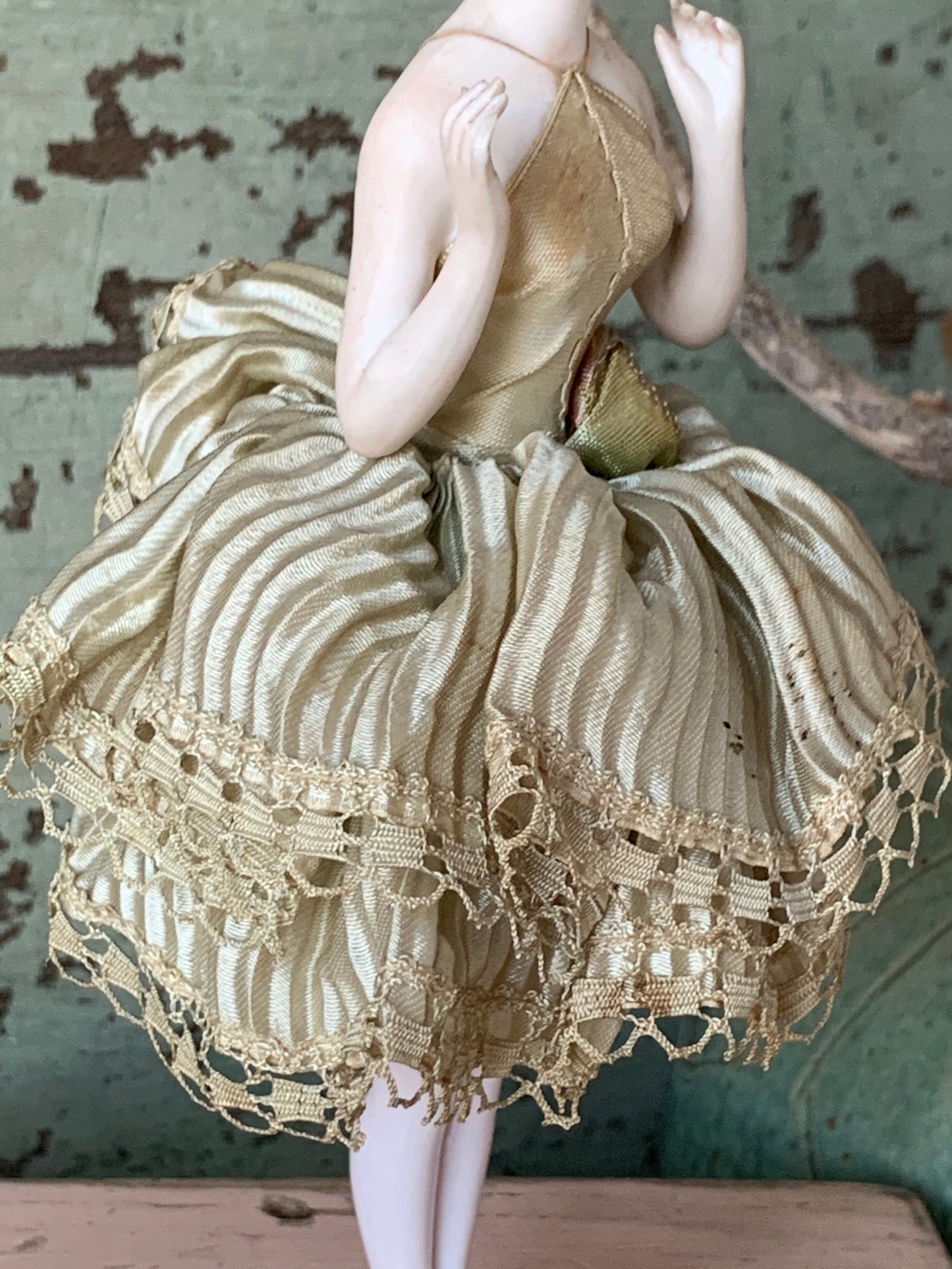 Antique porcelain masked girl figurine