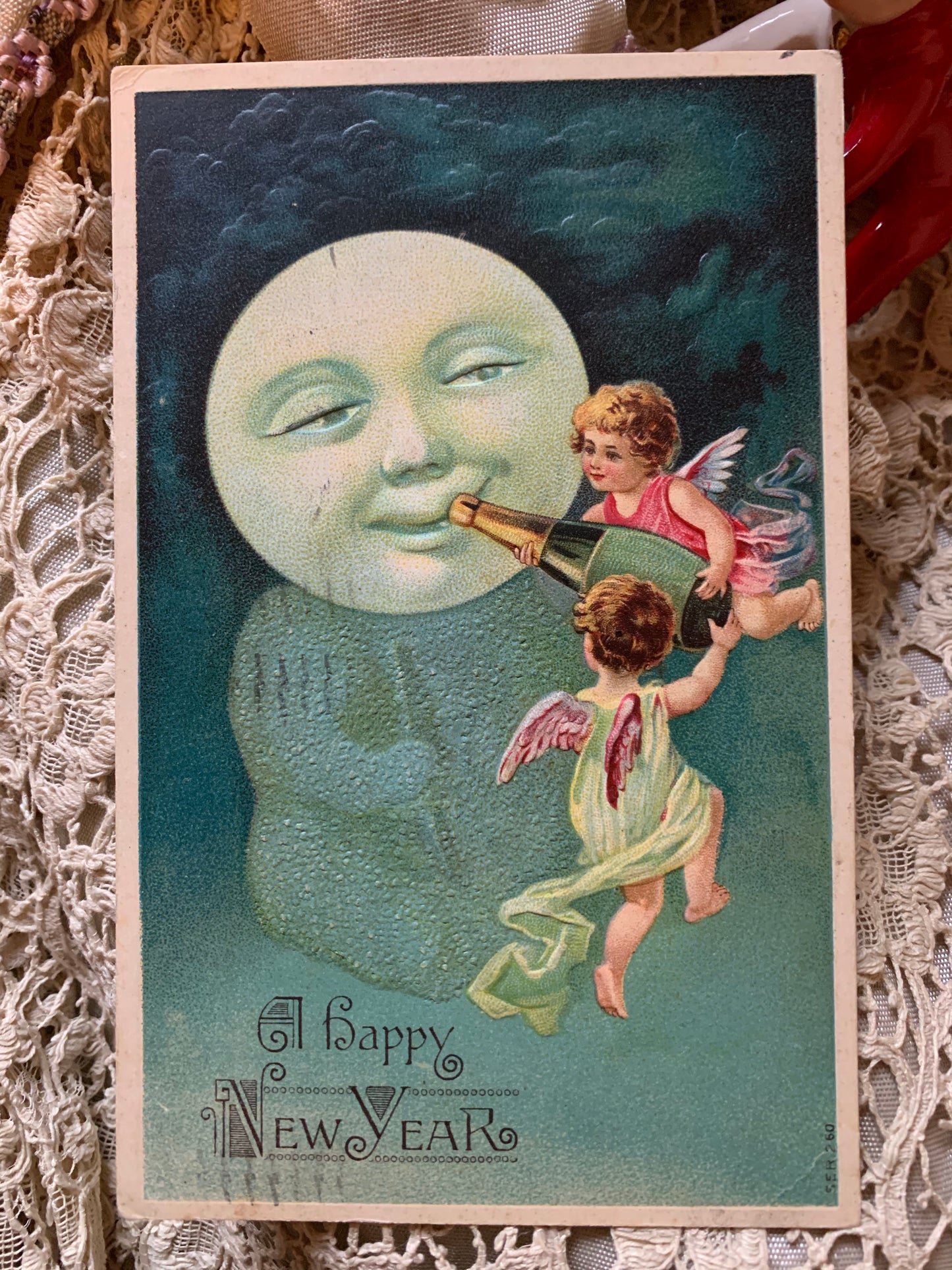 Antique Happy New Year moon baby postcard