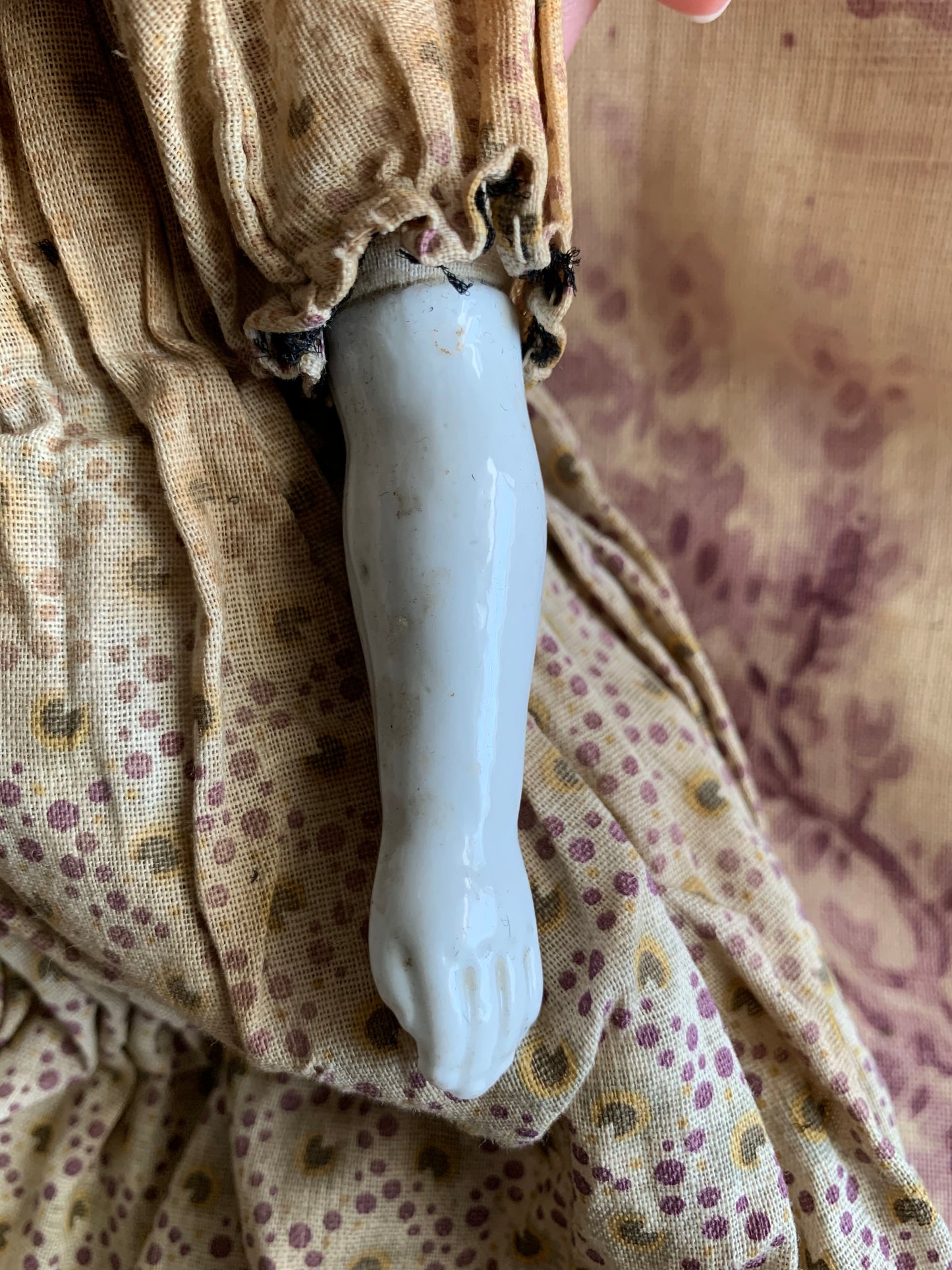 Antique china doll with blue boots