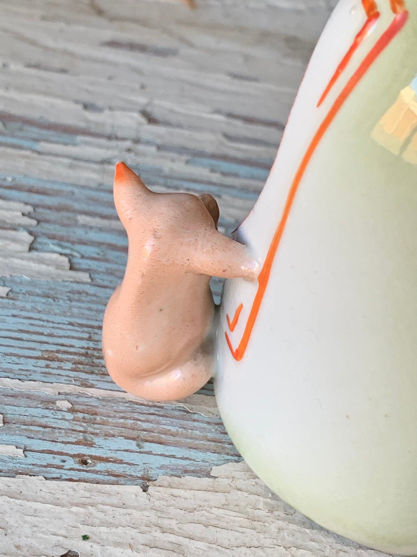 Antique porcelain devil and pig bottle figurine