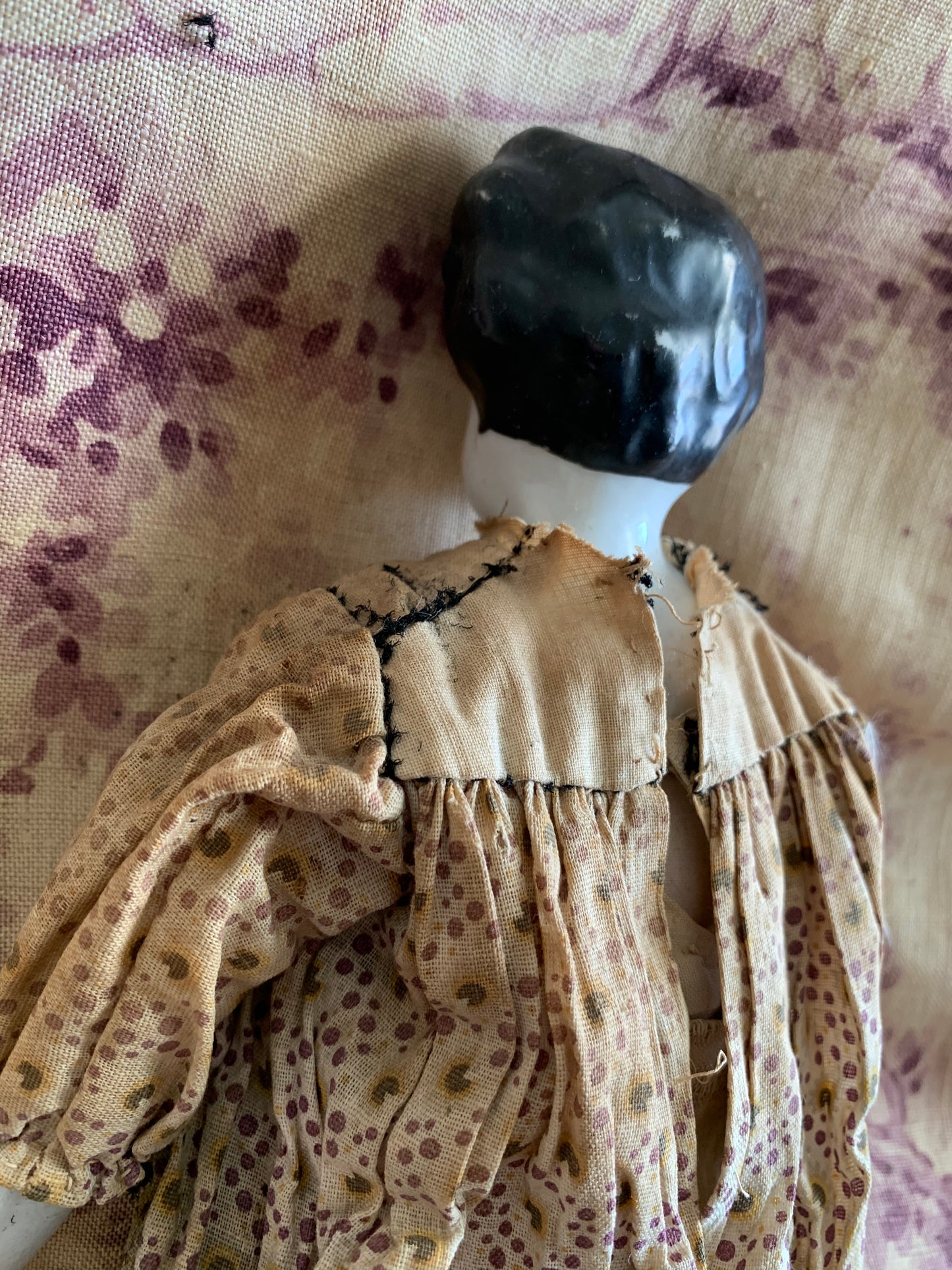 Antique china doll with blue boots