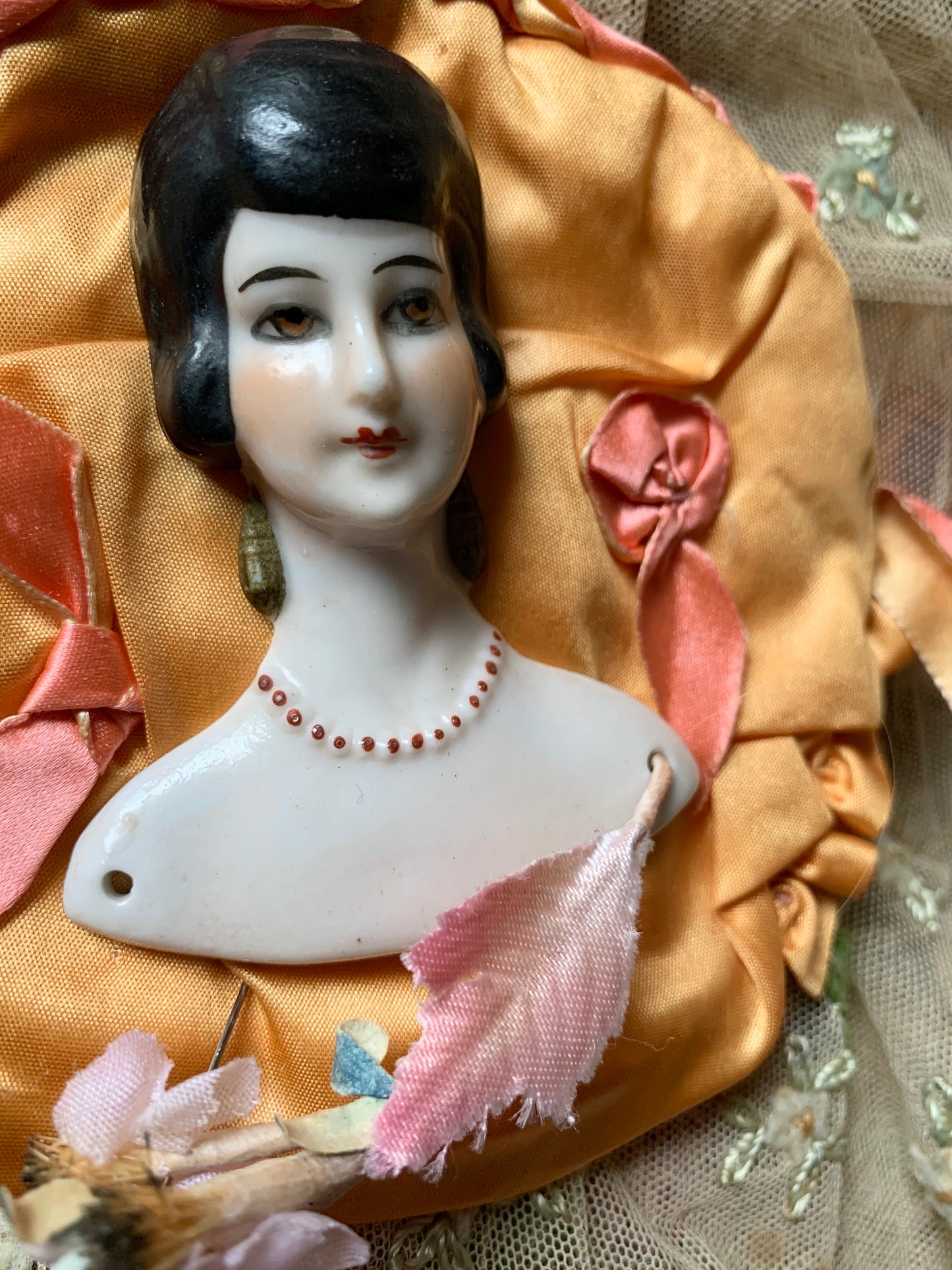 Vintage porcelain half doll flat back bust on silk