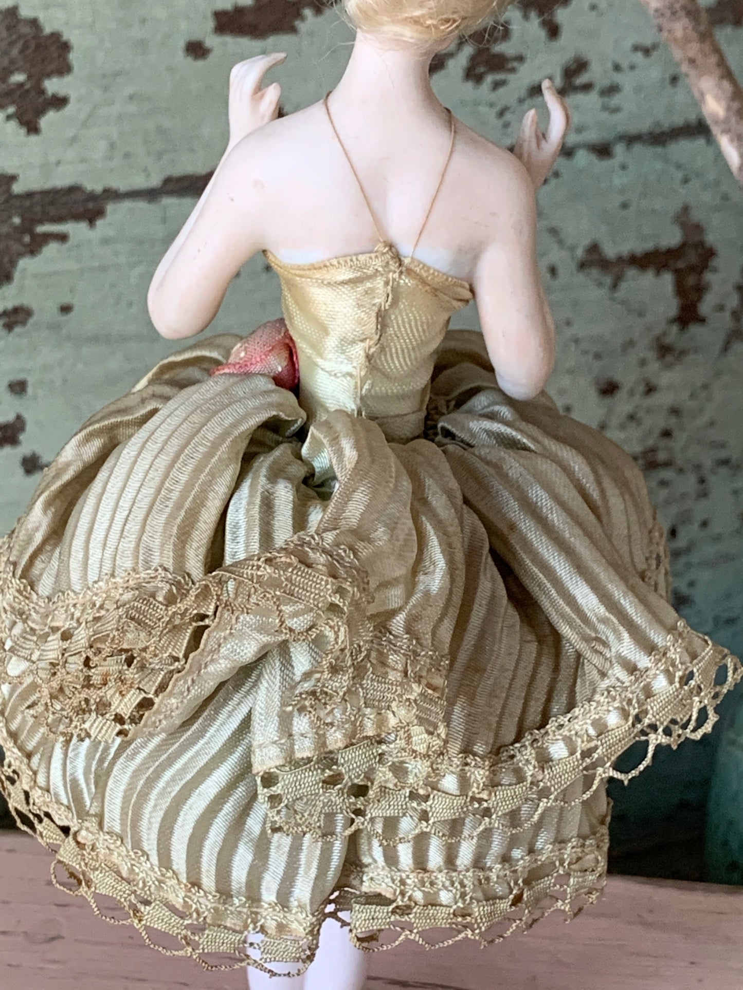 Antique porcelain masked girl figurine