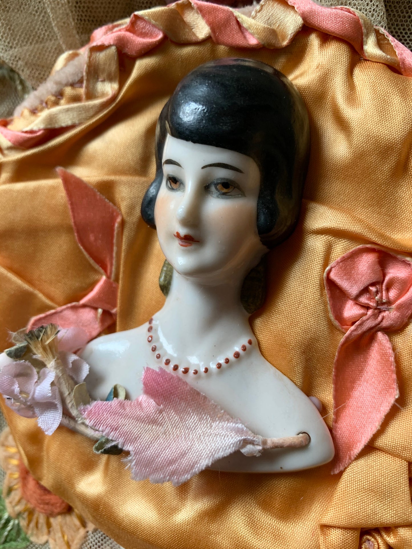 Vintage porcelain half doll flat back bust on silk