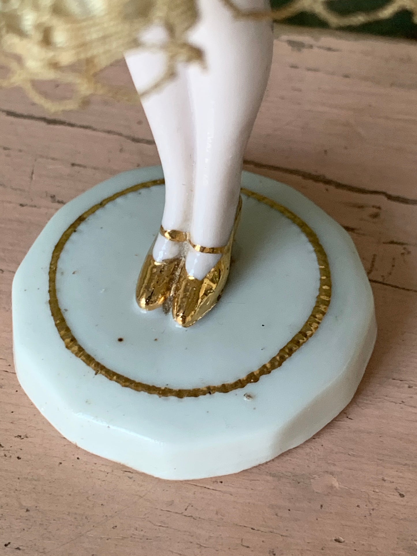 Antique porcelain masked girl figurine