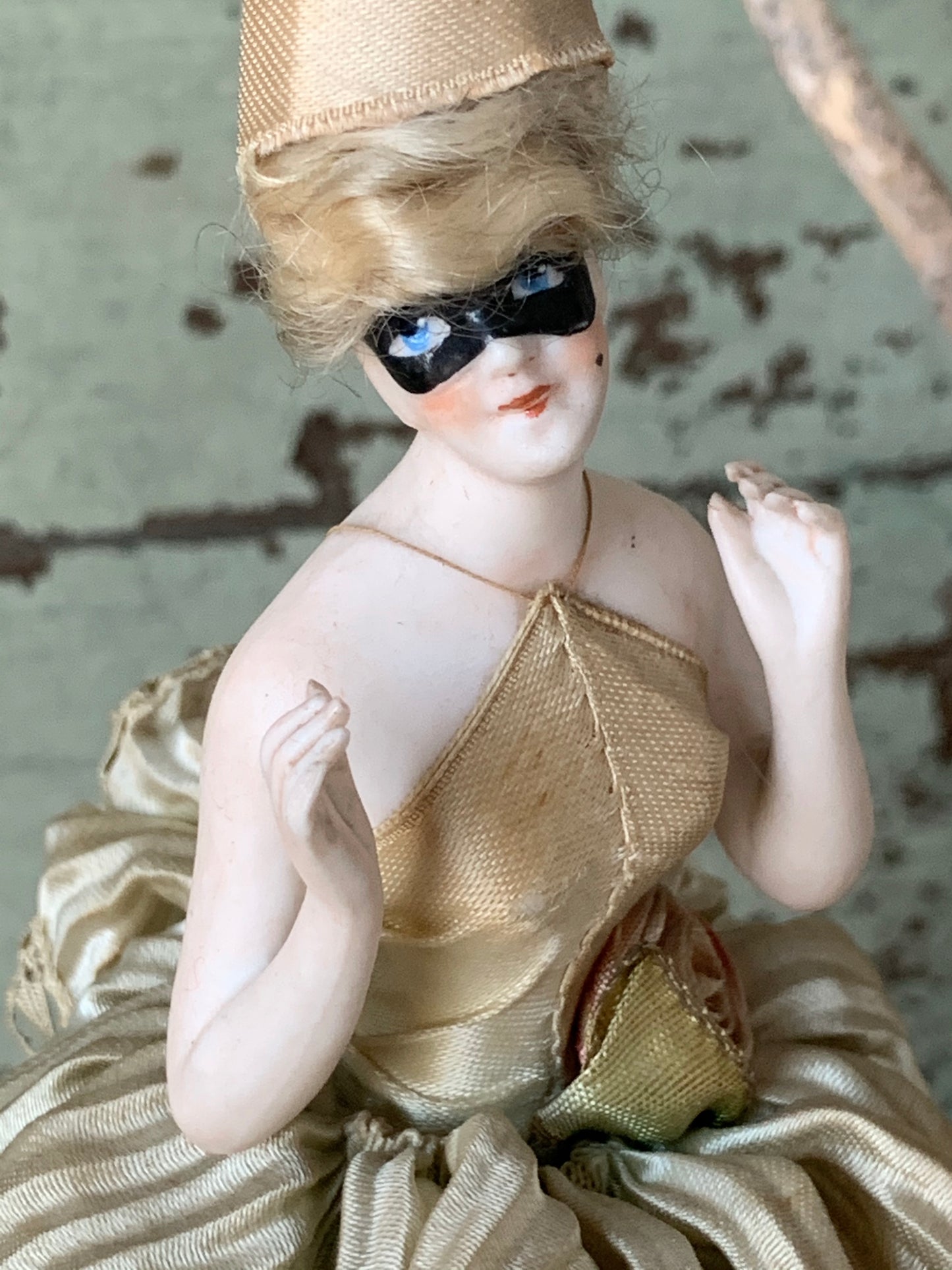 Antique porcelain masked girl figurine