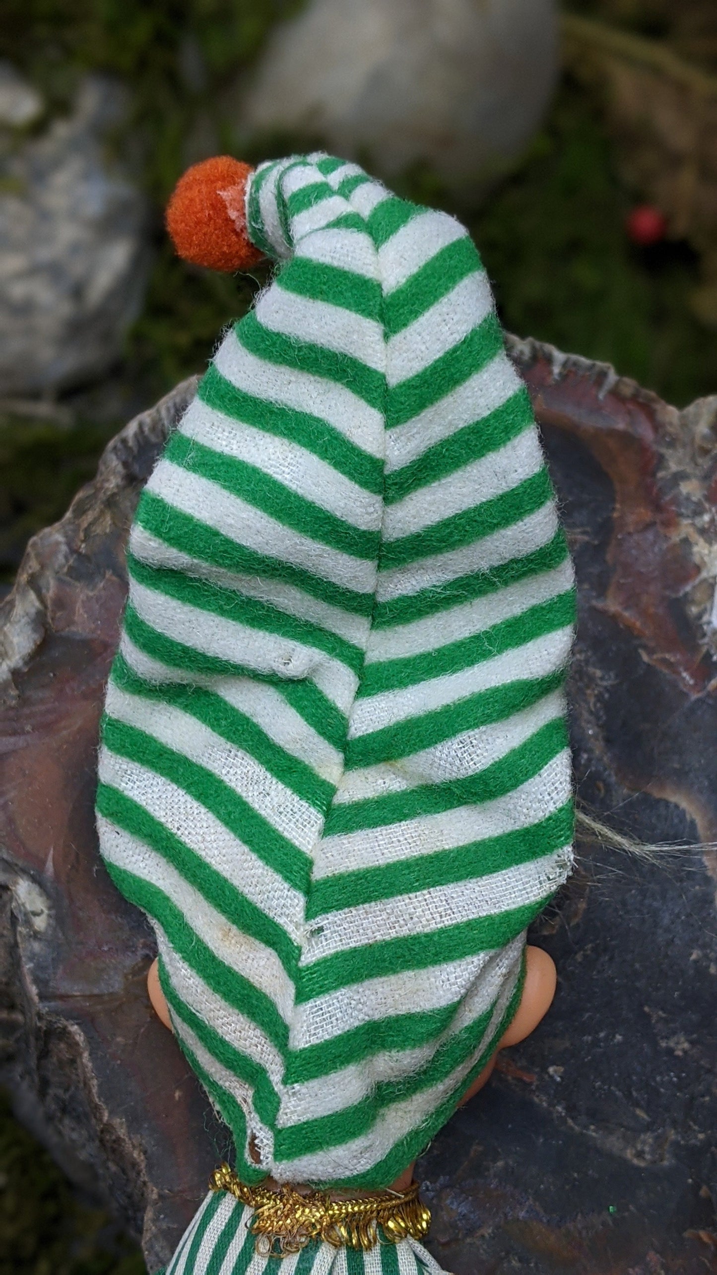 Vintage Christmas elf in green striped pajamas