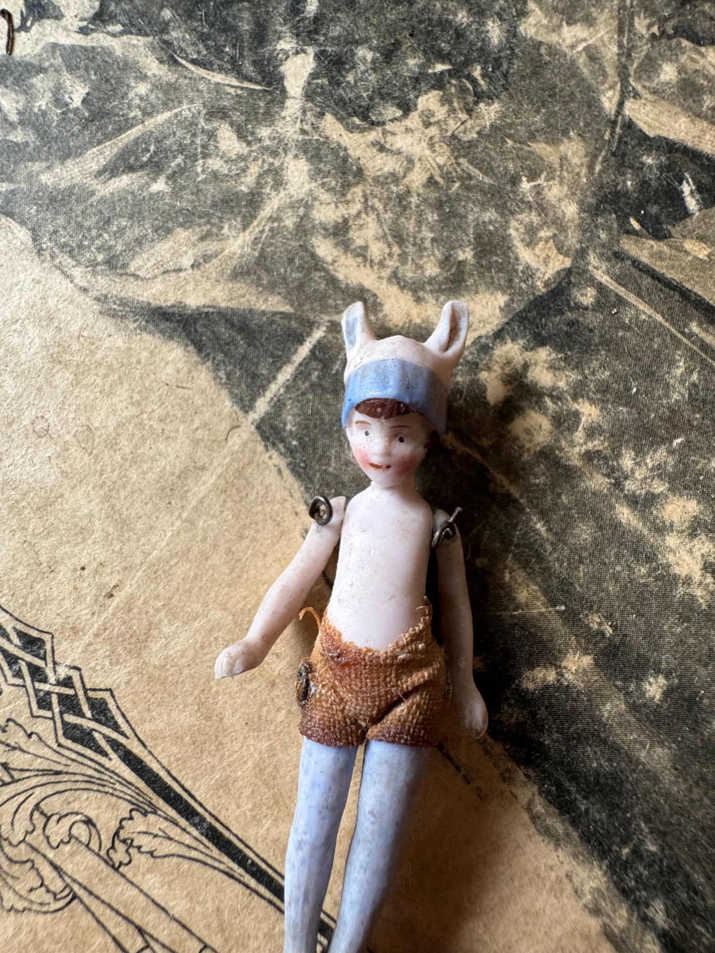 Antique miniature bunny girl doll tiny bisque doll