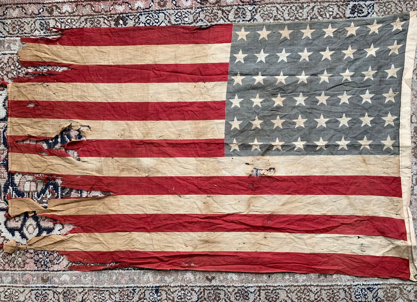 Vintage tattered old 48 star USA flag