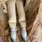 Antique china doll with blue boots