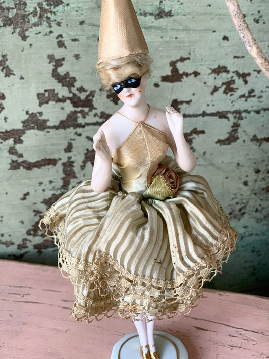 Antique porcelain masked girl figurine