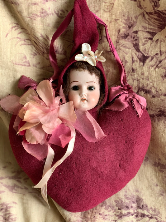 Antique doll head pincushion