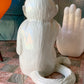 Vintage white capuchin monkey holding ball Italian statue