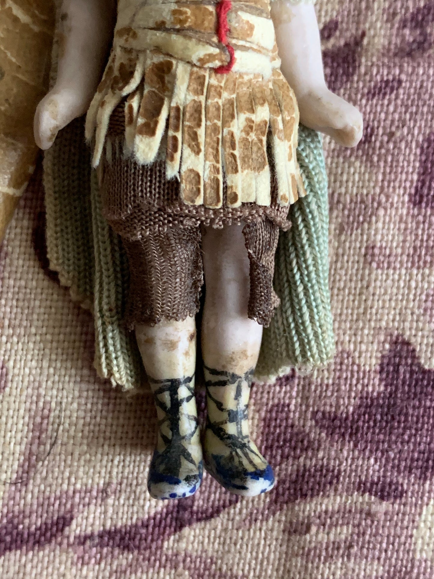 Antique miniature bisque warrior doll