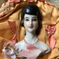 Vintage mini half doll bust on silk