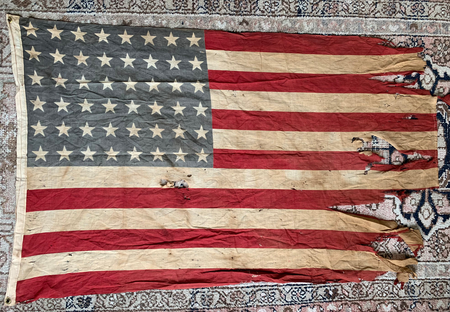 Vintage tattered old 48 star USA flag