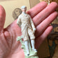Antique miniature golfer figurine