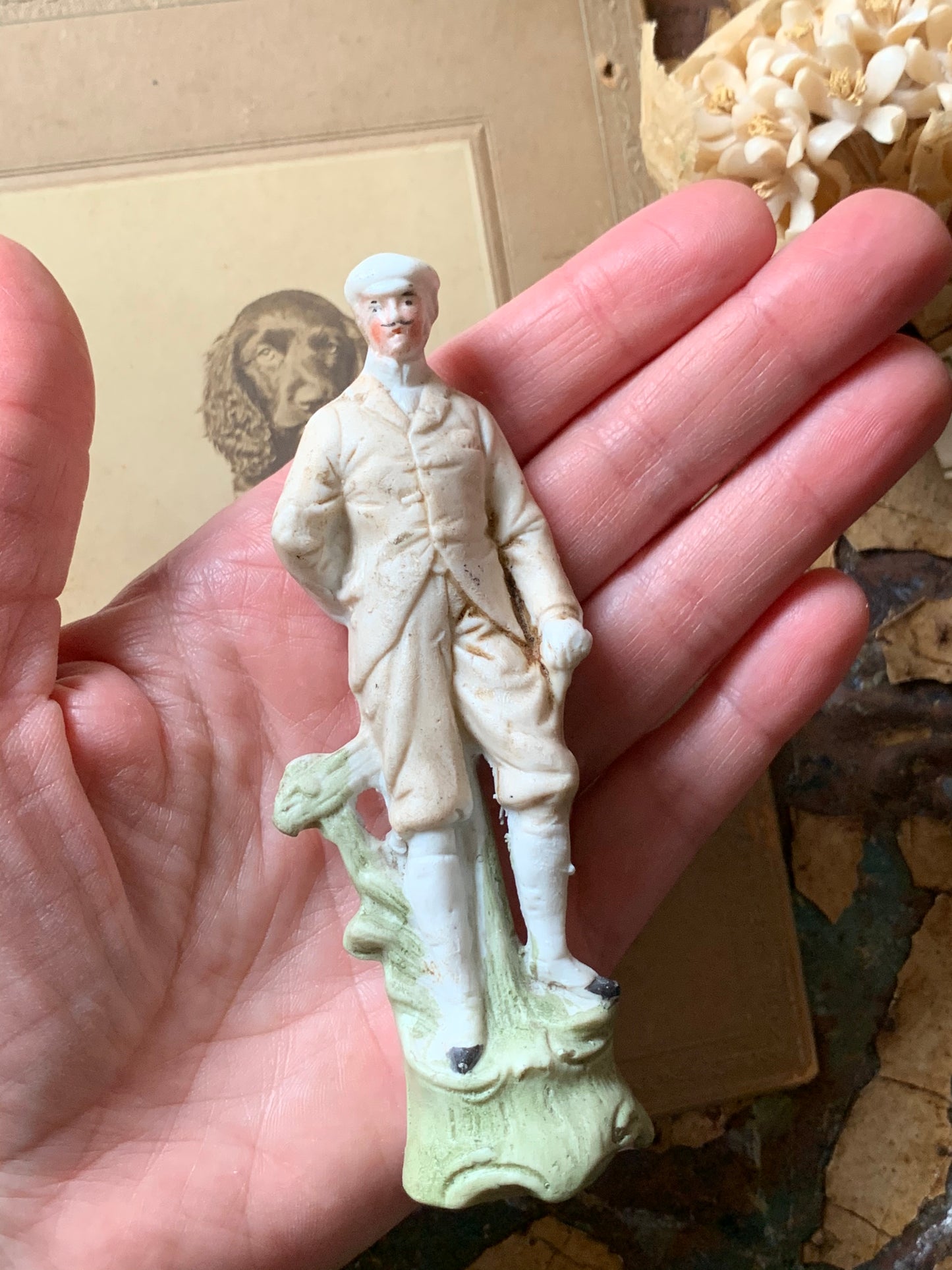 Antique miniature golfer figurine