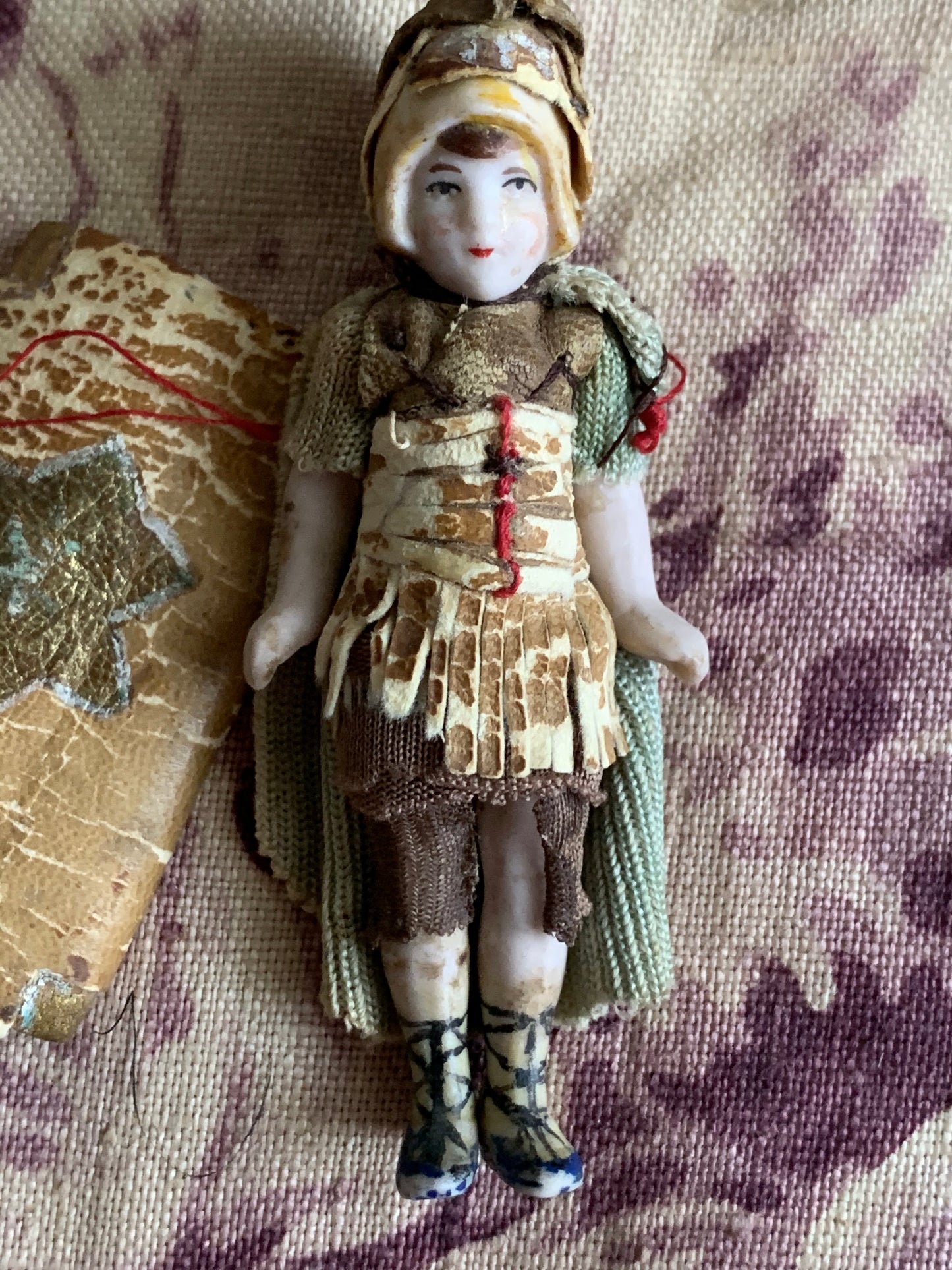 Antique miniature bisque warrior doll