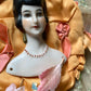 Vintage mini half doll bust on silk