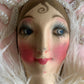 Assembled vintage boudoir doll face pillow