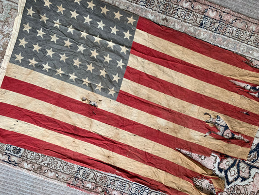 Vintage tattered old 48 star USA flag