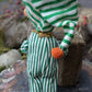 Vintage Christmas elf in green striped pajamas