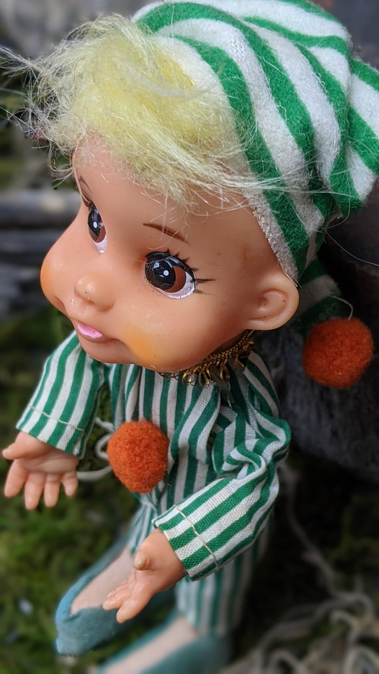 Vintage Christmas elf in green striped pajamas