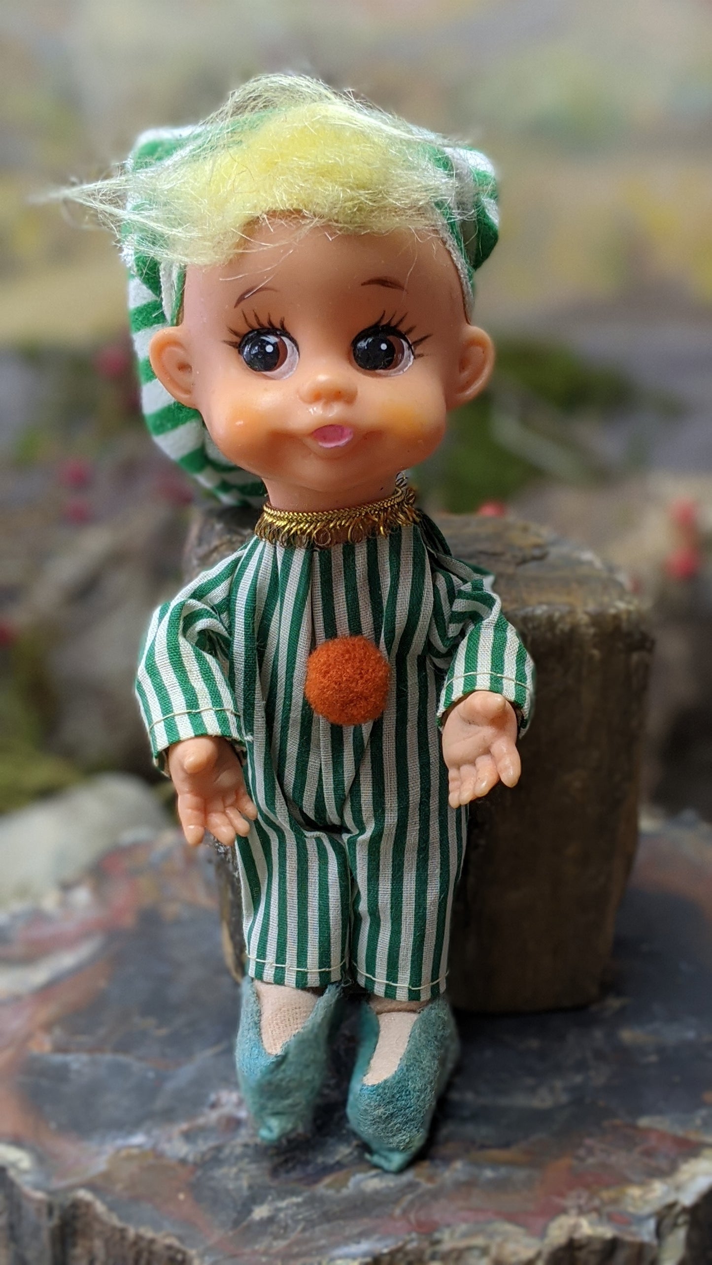 Vintage Christmas elf in green striped pajamas