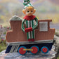 Vintage Christmas knee hugger on train